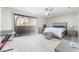 Bedroom with ceiling fan and carpet flooring featuring a desk, sliding glass door and exterior view at 3221 Yolanda Ln, Las Vegas, NV 89121