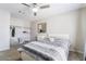 Bedroom with carpet floor features open closet, window with curtains, mirror, bed and ceiling fan at 3221 Yolanda Ln, Las Vegas, NV 89121