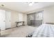 Bedroom with ceiling fan and carpet flooring featuring a desk, and sliding glass door to the outside at 3221 Yolanda Ln, Las Vegas, NV 89121