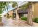 Attractive townhome exterior with landscaping and walkway to front door at 3221 Yolanda Ln, Las Vegas, NV 89121