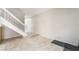 Minimalist hallway leading to a staircase featuring tile flooring at 3221 Yolanda Ln, Las Vegas, NV 89121