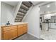 View of the kitchen with white cabinets, tile floor, and eat-in island at 3221 Yolanda Ln, Las Vegas, NV 89121