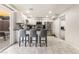 Kitchen and breakfast bar with stainless steel appliances and sliding patio doors at 3221 Yolanda Ln, Las Vegas, NV 89121