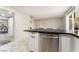 Kitchen bar featuring a stainless dishwasher and neutral colored walls at 3221 Yolanda Ln, Las Vegas, NV 89121