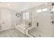 Modern bathroom featuring a soaking tub, glass shower, and bright natural light at 352 Dandelion Brook Ct, Las Vegas, NV 89148