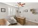 Charming bedroom with a ceiling fan and decorative wall art at 352 Dandelion Brook Ct, Las Vegas, NV 89148