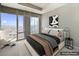 Serene bedroom with a large window showcasing city views and a comfortable bed at 3750 Las Vegas Blvd # 2711, Las Vegas, NV 89158