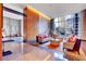 Grand lobby area with comfortable seating, modern decor, large windows, and natural light at 3750 Las Vegas Blvd # 2711, Las Vegas, NV 89158