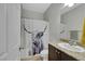 Bathroom featuring granite vanity, sink, toilet, and tub-shower combo at 4511 Townwall St, Las Vegas, NV 89115