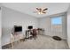 Bright bedroom featuring a ceiling fan, window, and carpeted floors at 4511 Townwall St, Las Vegas, NV 89115