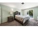 Serene bedroom with carpet, backyard access, and neutral colors creating a peaceful atmosphere at 4592 Cabo Ln, Las Vegas, NV 89121