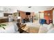 Open-concept living area featuring a kitchen, cozy seating, and stylish decor, with tile flooring throughout at 4592 Cabo Ln, Las Vegas, NV 89121