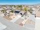 A single story home includes solar panels, desert landscaping, and a convenient two-car garage, offering ample parking at 4910 Marywood Ct, Pahrump, NV 89061