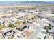 Expansive aerial view of homes in a desert community featuring varied rooftops and mountain views in the distance at 4910 Marywood Ct, Pahrump, NV 89061