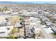 This aerial view captures the neighborhood with diverse homes, pools, and proximity to roads in desert landscape at 4910 Marywood Ct, Pahrump, NV 89061