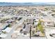 Aerial view displays a well-planned neighborhood with diverse homes, green spaces, and nearby roads at 4910 Marywood Ct, Pahrump, NV 89061