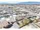 Aerial view highlights the surrounding neighborhood with mountain views and desert landscape in the distance at 4910 Marywood Ct, Pahrump, NV 89061
