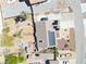 Aerial perspective showcases unique backyard design with a pool and landscaping features, enhanced by solar panels on the roof at 4910 Marywood Ct, Pahrump, NV 89061
