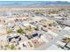 Aerial view shows neighborhood layout, with houses, pools, and manicured landscaping in a suburban desert setting at 4910 Marywood Ct, Pahrump, NV 89061