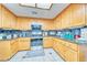 Well-appointed kitchen with wood cabinets, granite countertops, and modern appliances at 4910 Marywood Ct, Pahrump, NV 89061
