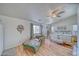 Spacious main bedroom with vaulted ceilings, a ceiling fan, and large windows at 4910 Marywood Ct, Pahrump, NV 89061