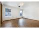 Bright, spacious bedroom with hardwood floors and large windows providing ample natural light at 516 Tabony Ave, Henderson, NV 89011
