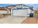 Front exterior of the detached garage and the driveway with space for parking multiple cars at 516 Tabony Ave, Henderson, NV 89011