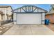 Front exterior of the detached garage and the driveway with space for parking multiple cars at 516 Tabony Ave, Henderson, NV 89011