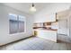 Bright, open kitchen features tile floors and a large window at 516 Tabony Ave, Henderson, NV 89011