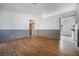 Open-concept living room with hardwood floors, seamlessly connecting to the kitchen and other living spaces at 516 Tabony Ave, Henderson, NV 89011
