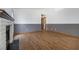 Comfortable living room featuring a charming brick fireplace and hardwood floors at 516 Tabony Ave, Henderson, NV 89011