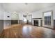 Bright living room with hardwood floors, fireplace, and multiple windows offering ample natural light at 516 Tabony Ave, Henderson, NV 89011