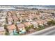 An aerial view of a neighborhood with homes, showcasing backyards, some with pools and green spaces at 5615 Believe Ct, Las Vegas, NV 89139