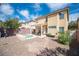 Large backyard with a hot tub, patio, pergola, and gravel landscaping, ideal for outdoor enjoyment at 5615 Believe Ct, Las Vegas, NV 89139