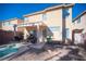 Exterior facade featuring jacuzzi and covered seating area at 5615 Believe Ct, Las Vegas, NV 89139