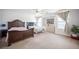 Spacious bedroom with two beds, ceiling fan, and windows, offering a bright and versatile space at 5615 Believe Ct, Las Vegas, NV 89139