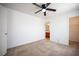 Empty bedroom with carpet flooring, ceiling fan, and ensuite bathroom at 5615 Believe Ct, Las Vegas, NV 89139