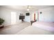 Spacious bedroom with two beds, ceiling fan, and windows, offering a bright and versatile space at 5615 Believe Ct, Las Vegas, NV 89139