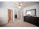 Spacious bedroom with ceiling fan, closet and ensuite bathroom, providing a comfortable layout at 5615 Believe Ct, Las Vegas, NV 89139