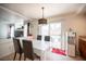 Dining area with backyard patio access and views of the living room at 5615 Believe Ct, Las Vegas, NV 89139