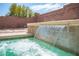 Close-up of the hot tub's water feature, showcasing the tile and design elements at 5615 Believe Ct, Las Vegas, NV 89139