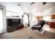 Bright living room with open floor plan, ceiling fan, and view of the adjacent kitchen and dining area at 5615 Believe Ct, Las Vegas, NV 89139