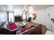 Spacious living room with a comfortable sofa, ceiling fan, and natural light at 5615 Believe Ct, Las Vegas, NV 89139