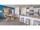 Open floor plan with a kitchen featuring modern appliances, counter seating, and stylish decor at 6168 Aster Garden St # 138, North Las Vegas, NV 89081
