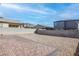 A spacious backyard offers a patio and desert landscaping, creating a serene outdoor space at 6833 Wispy Sky Ct, Las Vegas, NV 89142