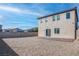 A spacious backyard offers a patio and desert landscaping, perfect for outdoor enjoyment at 6833 Wispy Sky Ct, Las Vegas, NV 89142