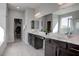 Bathroom boasts an elegant vanity with double sinks, ample counter space, and modern fixtures at 6833 Wispy Sky Ct, Las Vegas, NV 89142