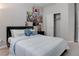 Bedroom featuring gray walls, gray carpet and a bed at 6833 Wispy Sky Ct, Las Vegas, NV 89142