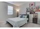 Bedroom featuring light gray walls and carpeting, paired with a comfortable bed at 6833 Wispy Sky Ct, Las Vegas, NV 89142