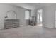 Neutral bedroom features carpet floors, abundant natural light, and matching dresser and chest at 6833 Wispy Sky Ct, Las Vegas, NV 89142